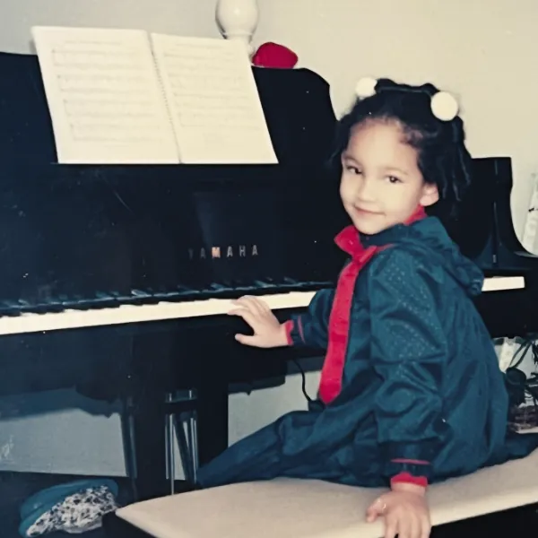 Young Gabrielle Faulkner at the piano.